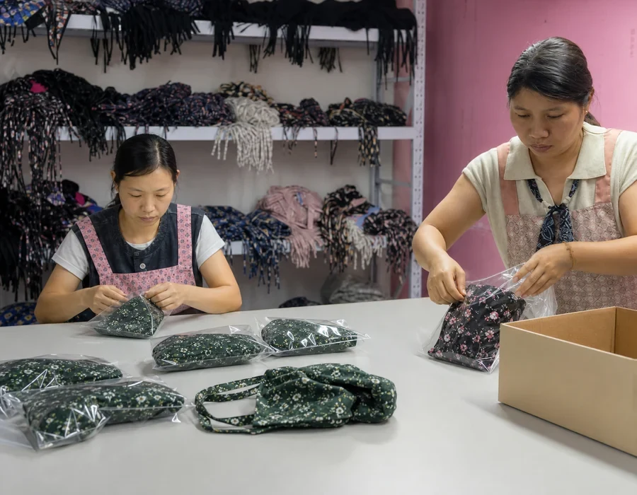Private label scrub caps being packed for international shipping